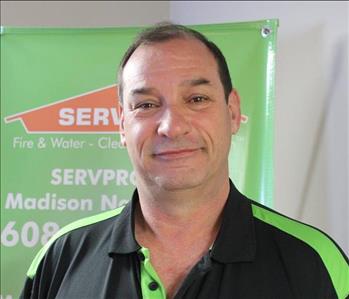 Picture of male employee Allen in front of a SERVPRO Banner