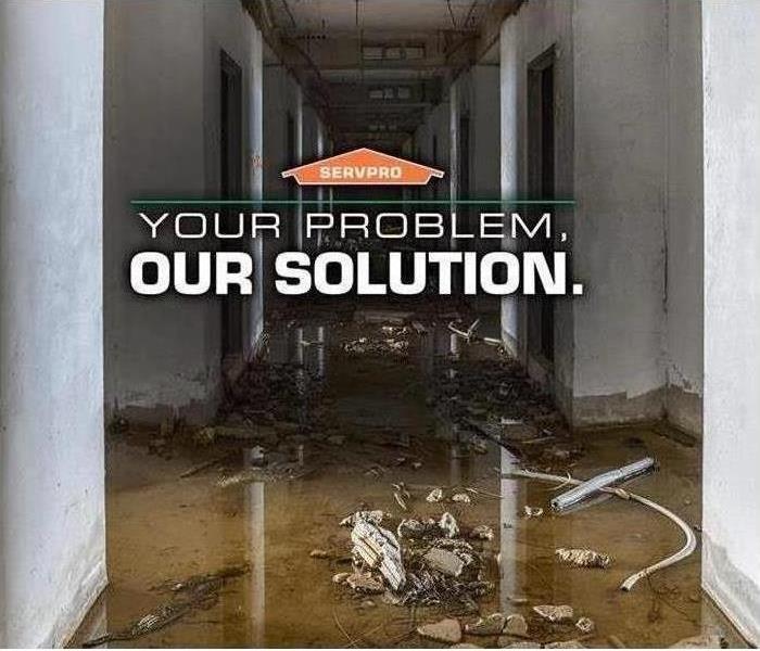picture of a hallway flooded with water and a SERVPRO logo with the words "your problem, our solution"