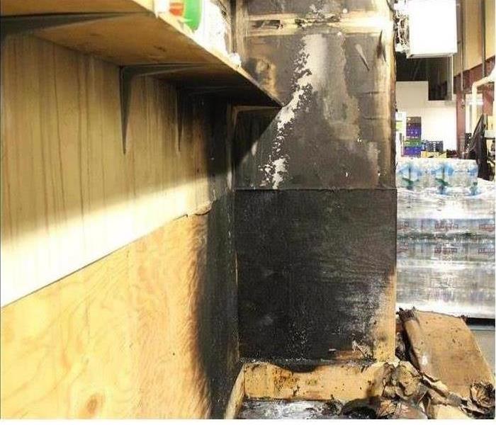 Picture of a wall with black soot covering it
