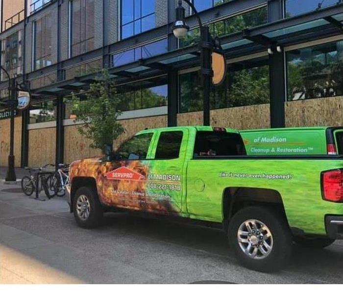 Picture of a SERVPRO truck in front of a large building